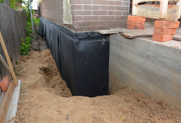 Happy homeowners after waterproofing job in Leslie